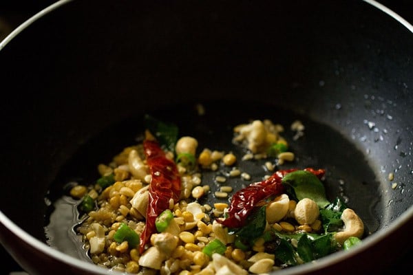 frying spices and lentils in pan. 