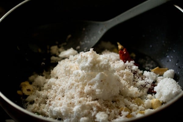finely grated coconut added in pan. 