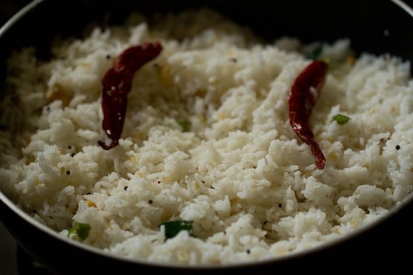 rice mixed in pan. 