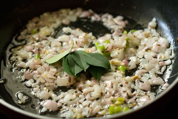 curry leaves and asafoetida added to the onion mixture. 