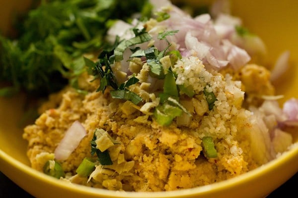 onions, ginger, herbs and salt added to ground masala vada mixture