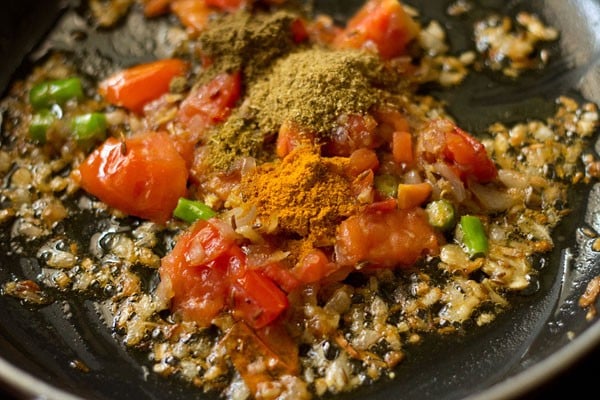 spice powders added to the pan. 