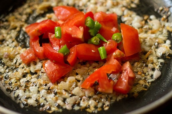 diced tomatoes and chopped green chilies added to the pan. 