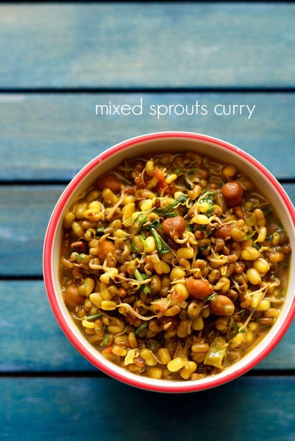 sprouts curry served in a red-rimmed ceramic bowl with text layover.