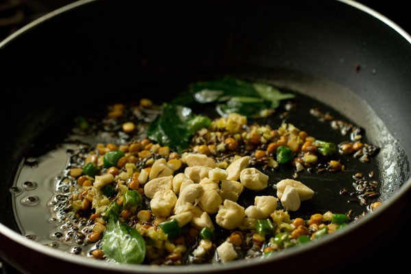 chopped cashews in pan.