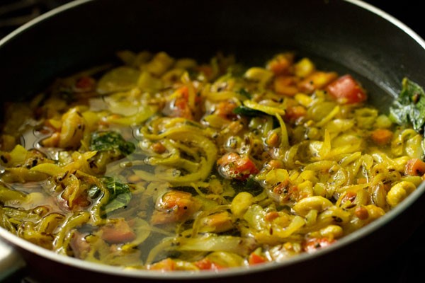 water in pan with cooked onions and other ingredients.