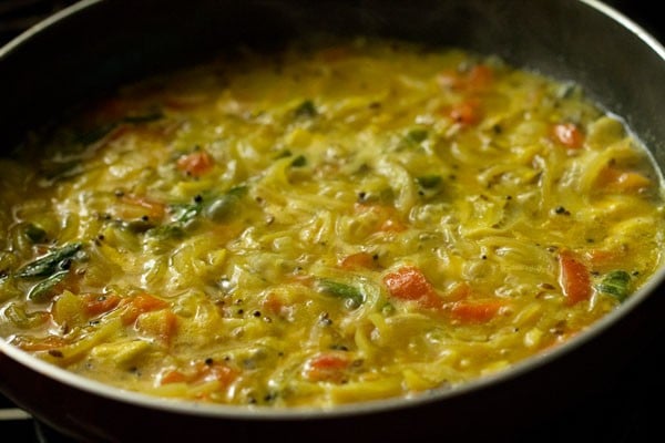 simmering puri curry in pan.