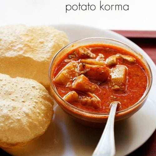 potato kurma served in a glass bowl with pooris kept on left side on a white plate with text layovers.