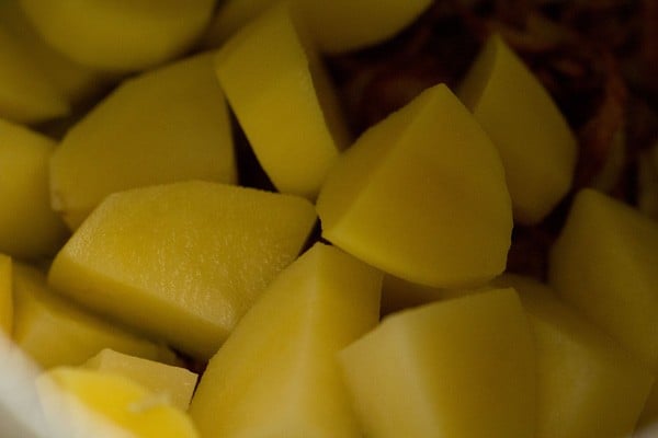 chopped potatoes added to the cooker. 