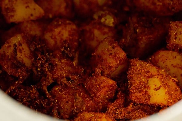 sautéing the masala with the potato-onion mixture. 