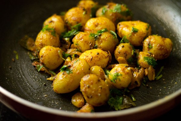 coriander leaves mixed well with the baby potatoes. 