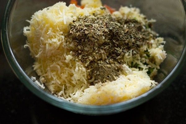 black pepper powder, dried oregano and dried basil added to the bowl. 