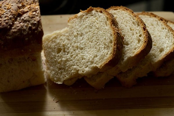 sliced bread on a chopping board. 