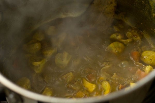 Mushroom biryani mixture in bowl.