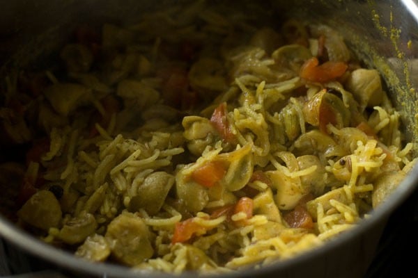 Cooked mushroom biryani mixture in pan