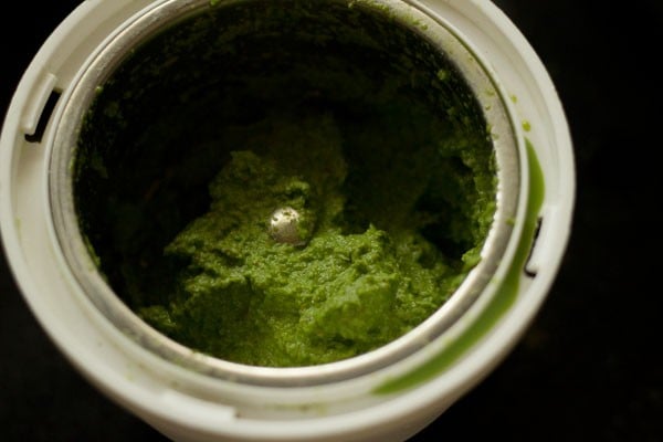 green coriander paste in the grinder jar