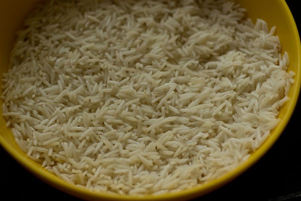 soaked and drained rice in a bowl