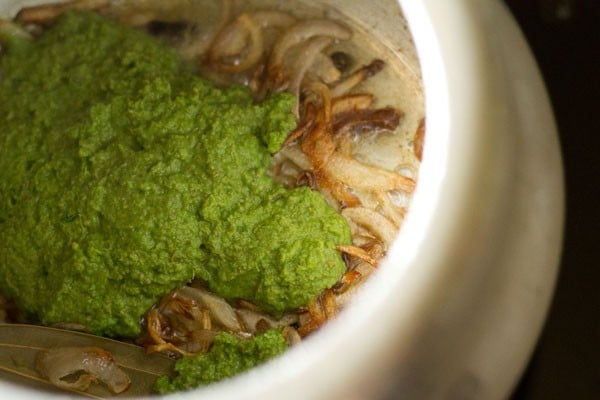 adding ground coriander-spices paste