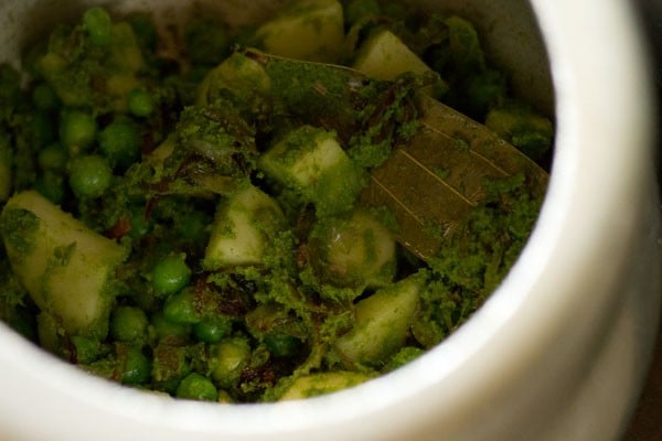 potato and green peas added to mixture