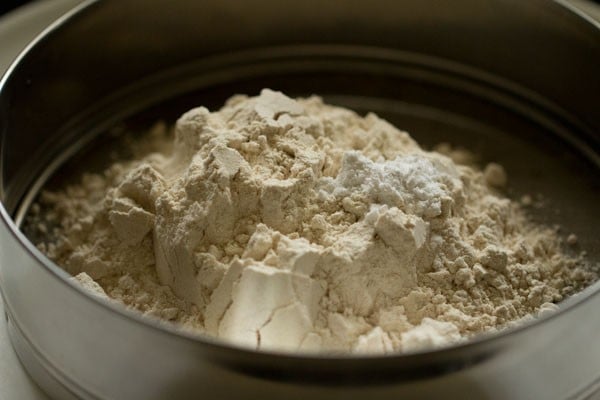 Dry ingredients for muffin recipe in  a sieve