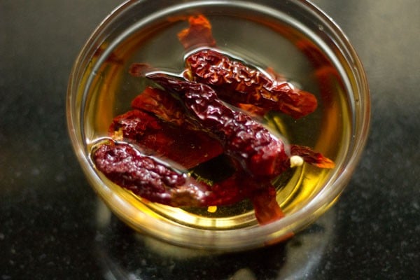 soaking dried red chilies in hot water. 