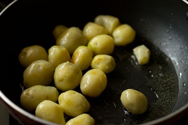 pan frying baby potatoes. 