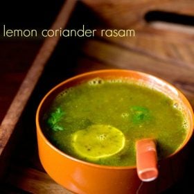 The lemon rasam is served in a brown bowl with a spoon inside and text layover.