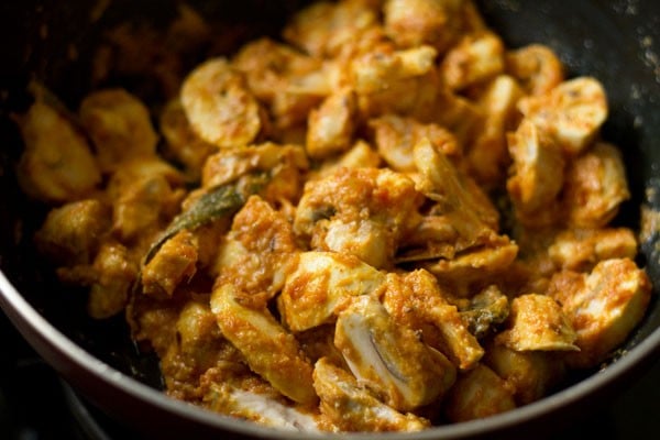 stirring mushroom masala mixture in the pan