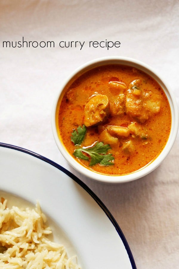 mushroom masala garnished with coriander sprigs in a white bowl on a white board