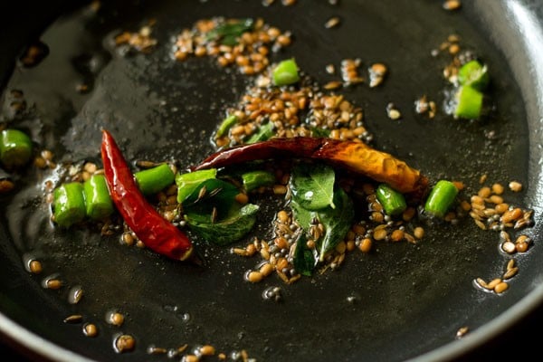 sautéing red chilies in pan. 