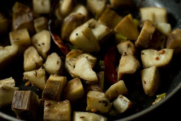 cooking raw banana poriyal in pan