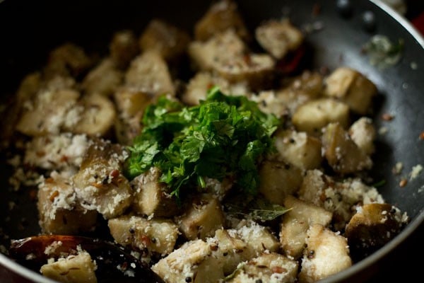 Add chopped coriander leaves to the pan. 