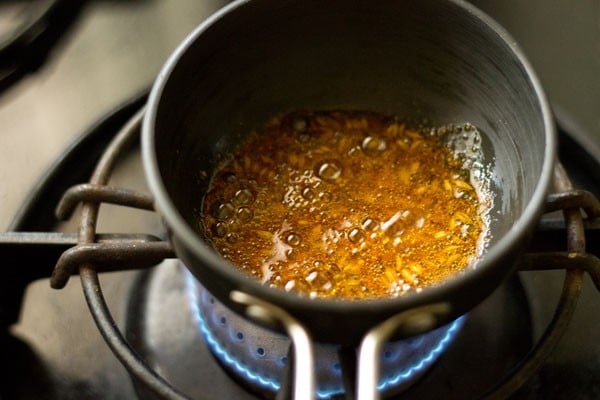 red chilli powder added to hot oil.