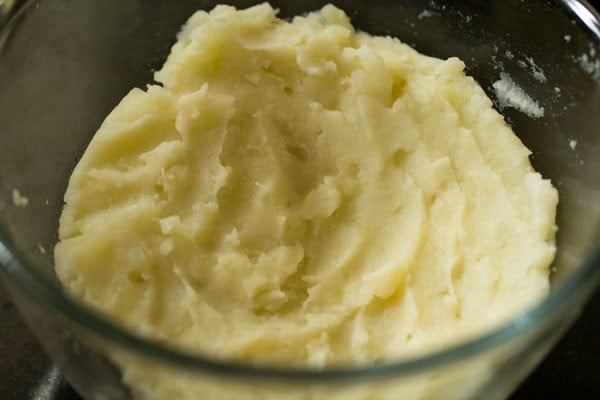 boiled, peeled and mashed potatoes added in a bowl for aloo kofta. 