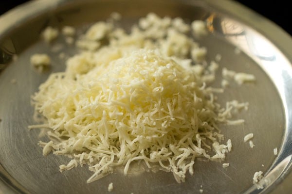 grated processed cheese on a plate. 
