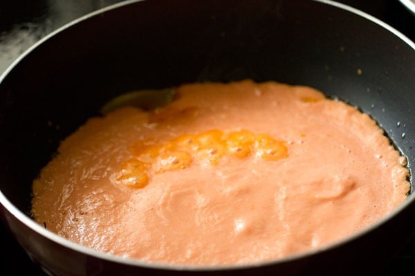 prepared tomato-onion-almond paste in the pan. 