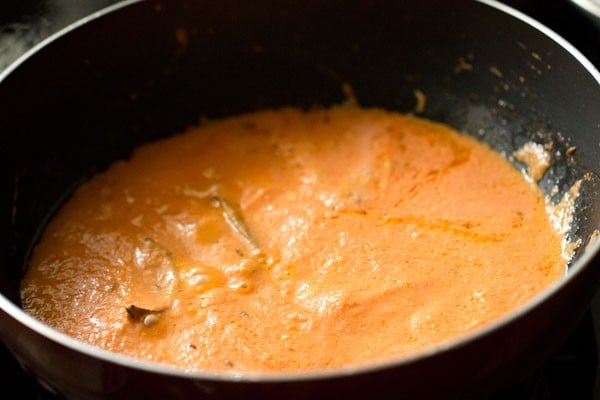 stirring the paste well with the spices. 