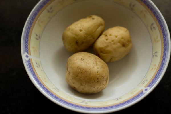 three potatoes in a bowl