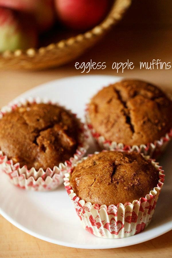 eggless apple muffins served on a white plate.