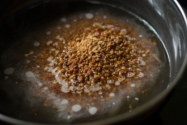 warm water with jaggery in a pan