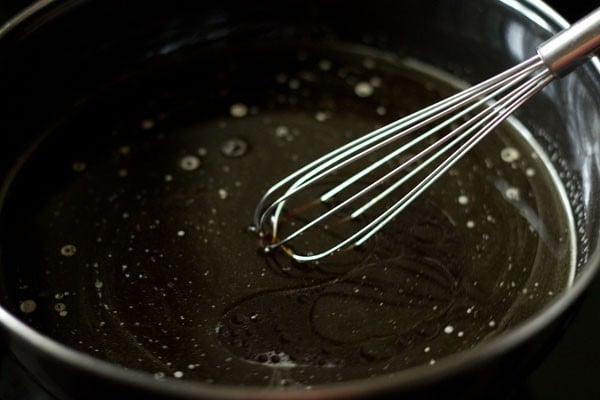 mixing vanilla extract and oil with water