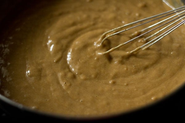 mixing to make eggless apple muffins batter