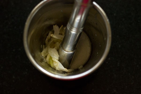 crushing garlic cloves. 