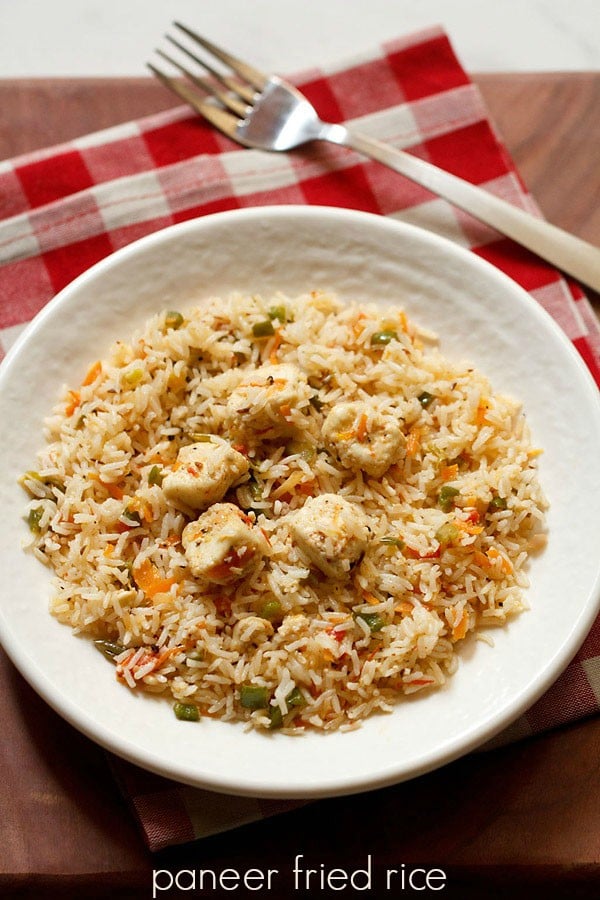 paneer fried rice served on a white plate.