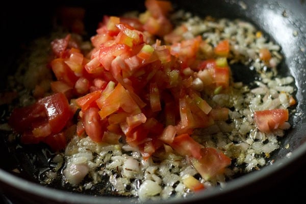 chopped tomatoes added to mixture