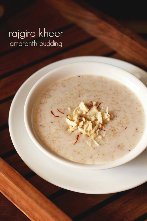 rajgira kheer garnished with slivered almonds, saffron strands and served in a white bowl kept on a white plate. and text layover.