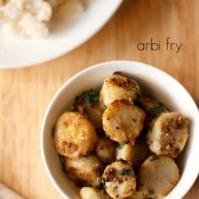 arbi fry served in a bowl with a side of samvat rice and text layover.