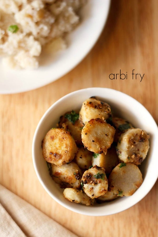 arbi fry served in a bowl with a side of samvat rice and text layover.