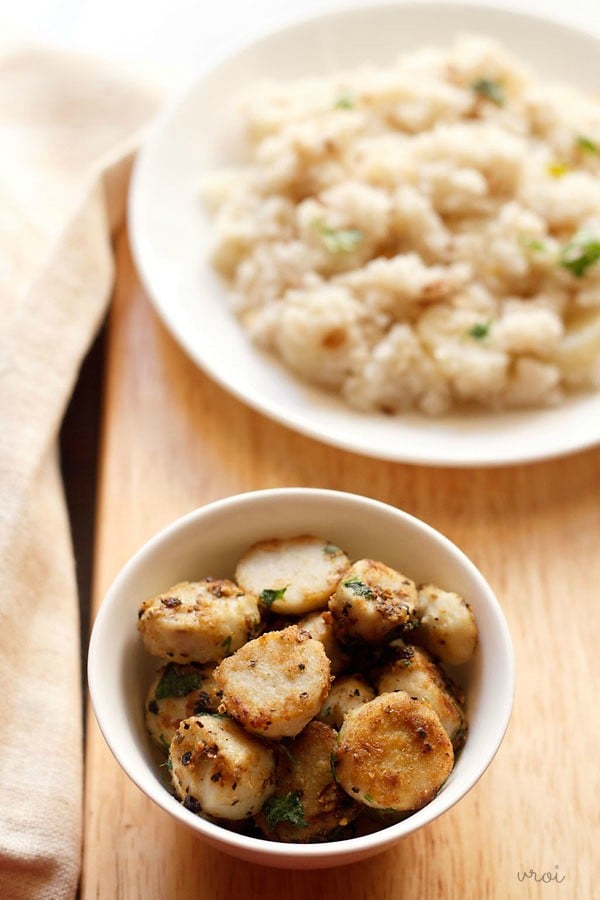 arbi fry served in a bowl with a side of samvat rice