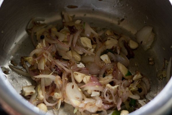 mixing onion, spice mixture.